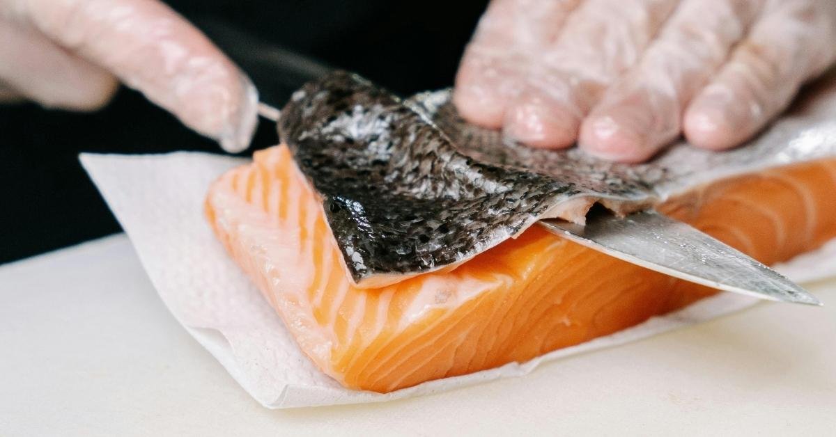 Skinning the salmon fish